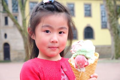 Portrait of cute girl holding ice cream