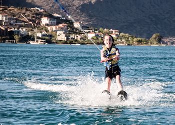 Woman jumping in sea