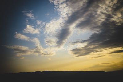 Low angle view of dramatic sky during sunset