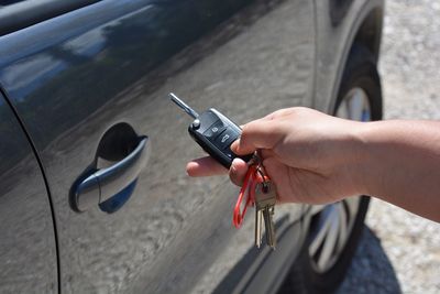 Cropped holding car lock