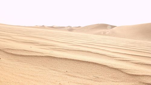 Scenic view of desert against clear sky