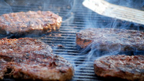 Close-up of meat on barbecue grill