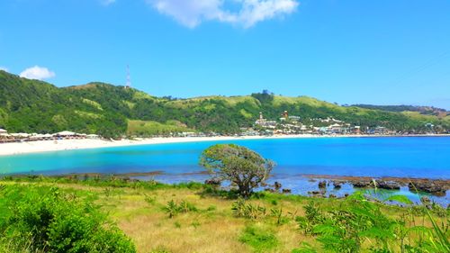 Scenic view of sea against blue sky