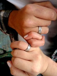 High angle view of couple making pink promise