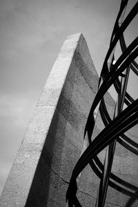 Low angle view of monument against cloudy sky