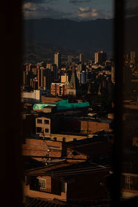 High angle view of buildings in city against sky
