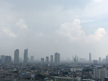 Modern buildings in city against sky