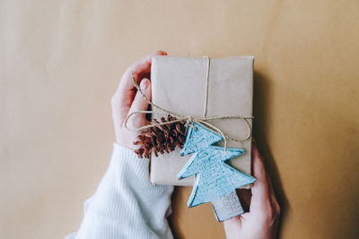 Cropped hand holding gift