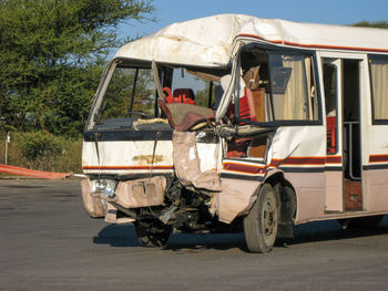 View of broken bus on road