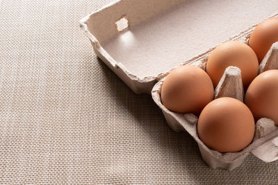 High angle view of eggs in container on table