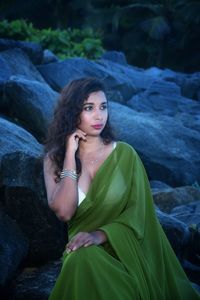 Young woman wearing sari while sitting outdoors