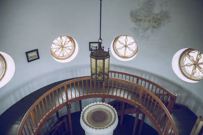 Low angle view of illuminated chandelier on building