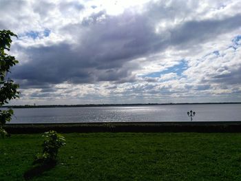 Scenic view of sea against cloudy sky