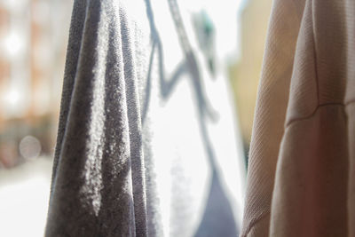 Close-up of clothes hanging on metal