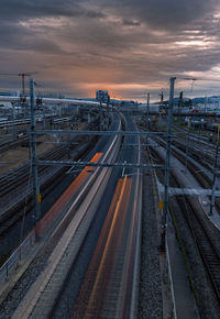 High angle view of railroad tracks against sky during sunset