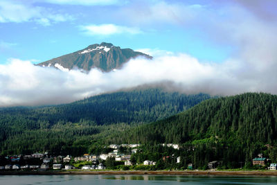 Alaska's landscape from the water. mountains with clouds below then