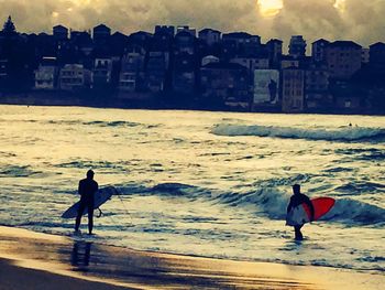 Silhouette of people on beach