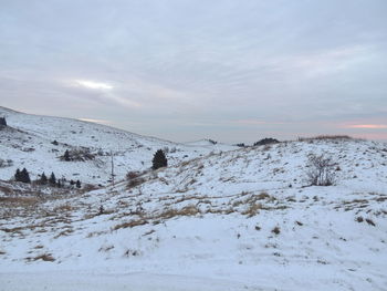 Scenic view of snow covered mountain against sky