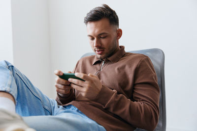 Young man using phone