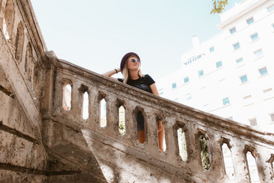 Happy tourist woman posing in upstairs in majorca