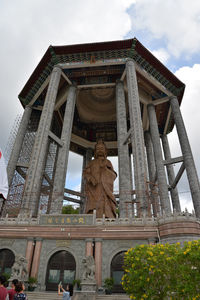 Low angle view of statue against sky