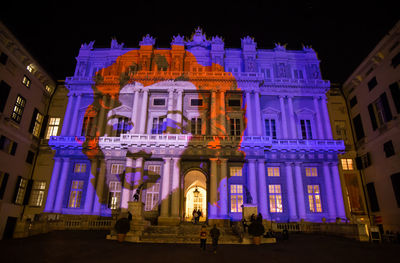 Low angle view of illuminated building at night