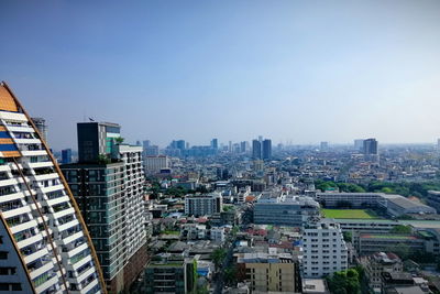 High angle view of modern buildings against clear sky