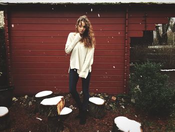 Full length of woman standing by railing