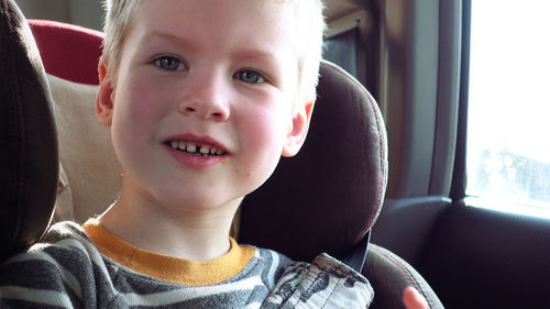 Portrait of boy sitting in car