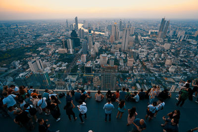 High angle view of crowd against buildings in city