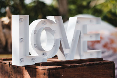 Close-up of love text on wooden table