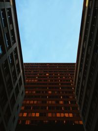 Low angle view of office building against sky