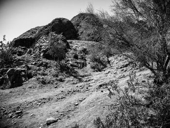 Low angle view of rock formation against sky