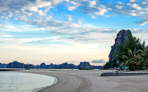 Scenic view of beach against sky during sunset