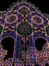 Low angle view of illuminated lights at night