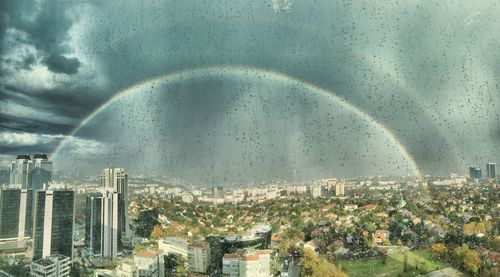 Aerial view of cityscape against sky