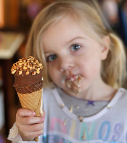 Portrait of woman holding ice cream