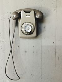 Close-up of telephone on wall