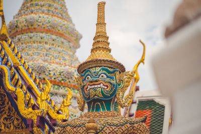 Statue of temple against building