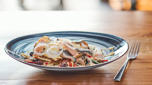 Close-up of food served on table