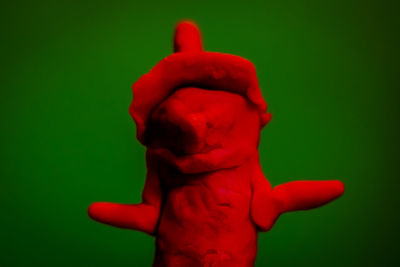 Close-up of red object over white background