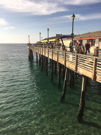 Pier over sea against sky