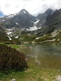 Scenic view of mountains and lake against sky
