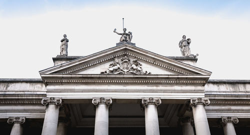 Low angle view of statue against building