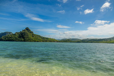 View of lake against cloudy sky