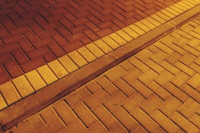 Full frame shot of footpath in city at night