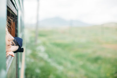 Woman looking out of train's window