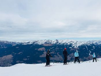 Group of skiers on the slope in the austrian alps in kaltenbach