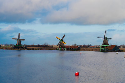 Traditional windmill against sky