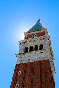 Low angle view of church against blue sky